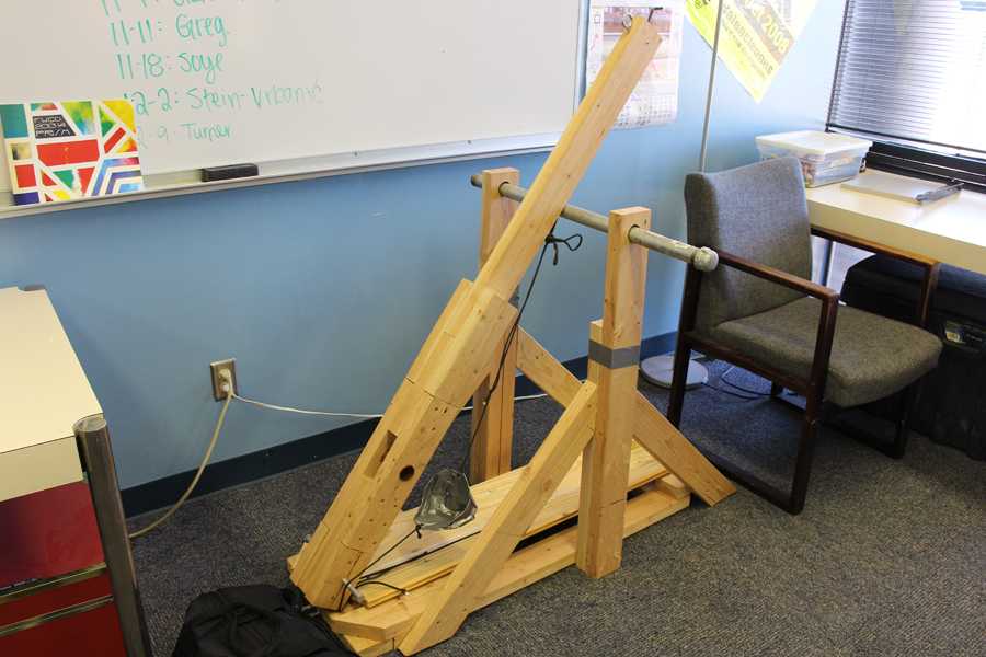 Clark Sheets 18, Jack Stephens 18, and Turner Symonds 18 built this catapult from scratch. Photo by Nate Wallace.