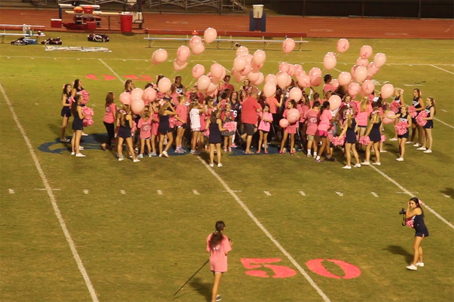 Breast+cancer+survivors+and+their+families+were+honored+during+the+halftime+of+the+Falcon+varsity+football+game+versus+Holland+Hall+in+October.