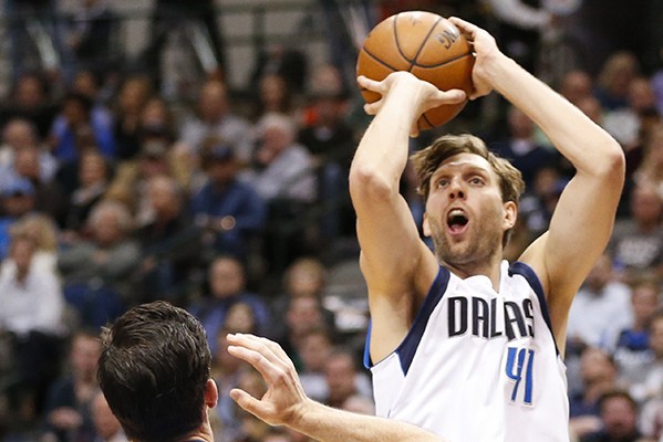 The Dallas Mavericks' Dirk Nowitzki (41) shoots over the Oklahoma City Thunder's Nick Collison (4) during the first half on Wednesday, Feb. 24, 2016, at the American Airlines Center in Dallas. (Jim Cowsert/Fort Worth Star-Telegram/TNS)