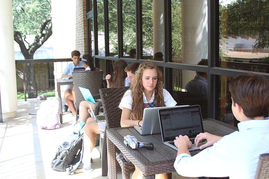 Christina Kelly 18 and Wyatt Allsup 18 work on their laptops and enjoy the new patio.
