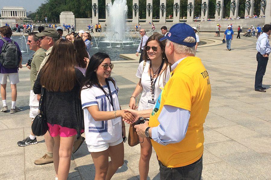 Mia+Pulido+17+shakes+hands+with+a+veteran+at+the+World+War+II+Memorial+in+Washington%2C+D.C.+in+May+2015%2C+as+part+of+the+annual+FWCD+sophomore+trip+to+DC.