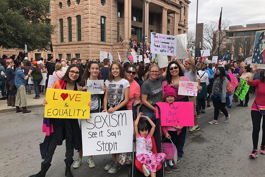 Christi Alvear marches with daughters and friends in Sundance Square.