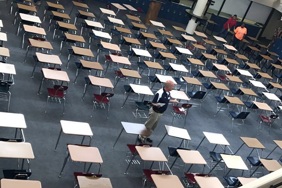 Teachers line up desks in the US commons, where finals are traditionally held. 