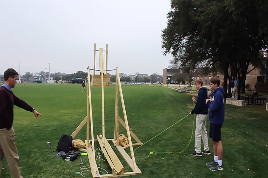 Aiden Meeker 19 and Dillon Flynn 19 prepare to launch their catapult.