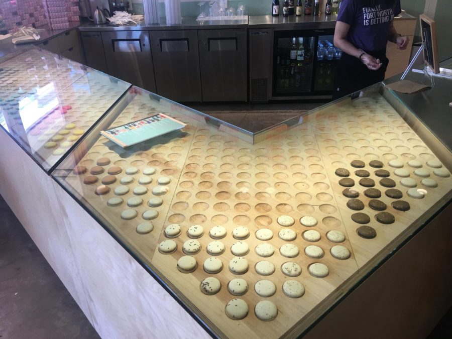 The rolling rack of macarons shows the flavors of the day.