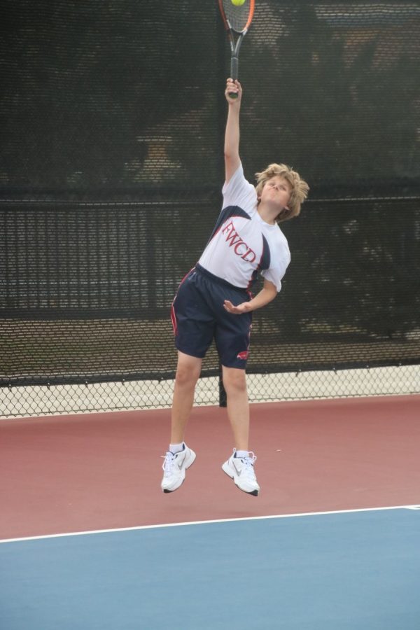 Benjamin Hoppe 24 serves at a tennis match last spring.