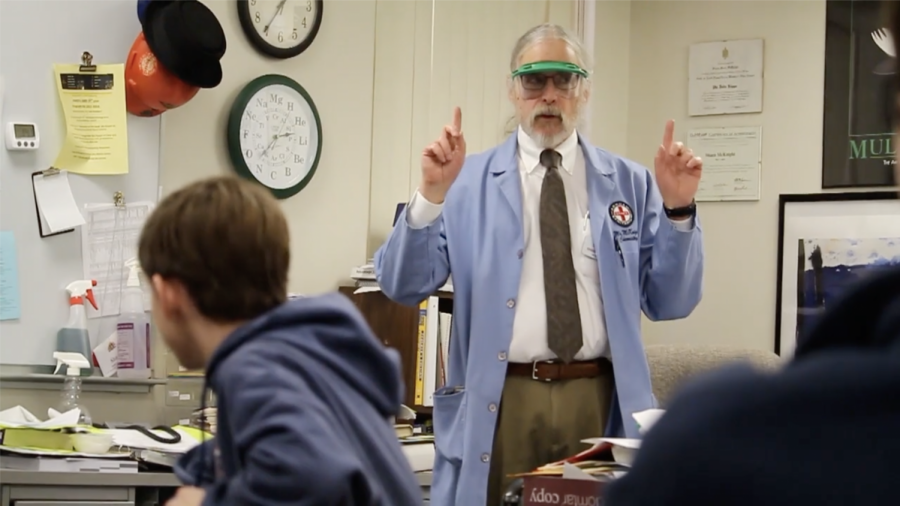 Mr. McKnight provides students with instructions before they begin a chemistry lab.