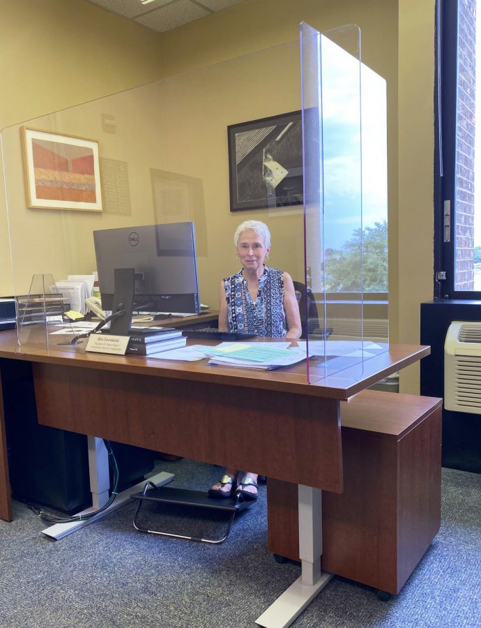 Rita Zawalnicki at her desk in the office. 
Photo by Lisa Wallace.
