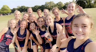 Varsity teammates pose for a selfie after a game.