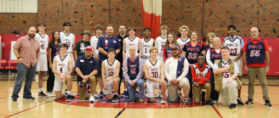 The JV Red Basketball team celebrates the FWCD faculty and staff.