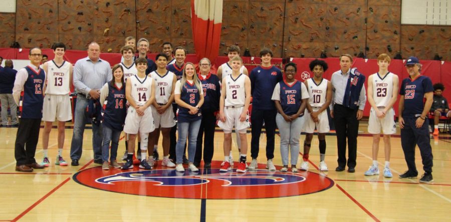 The Varsity Basketball team honors FWCD faculty and staff before their game against the Carter-Riverside Eagles.