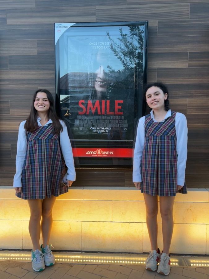 We+smiled+next+to+the+Smile+poster.