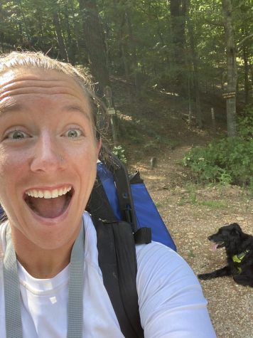 Katie Walker hiking with her dog.