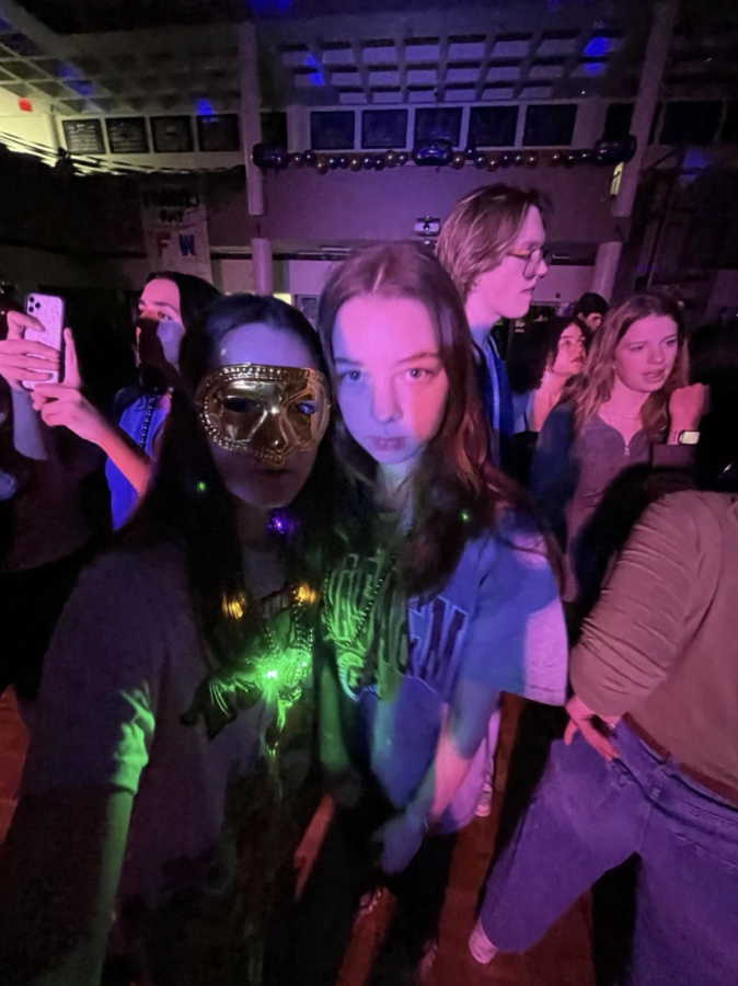 Carly Walker 24 and Ashlyn McPeak 24 taking pictures together at the dance.
