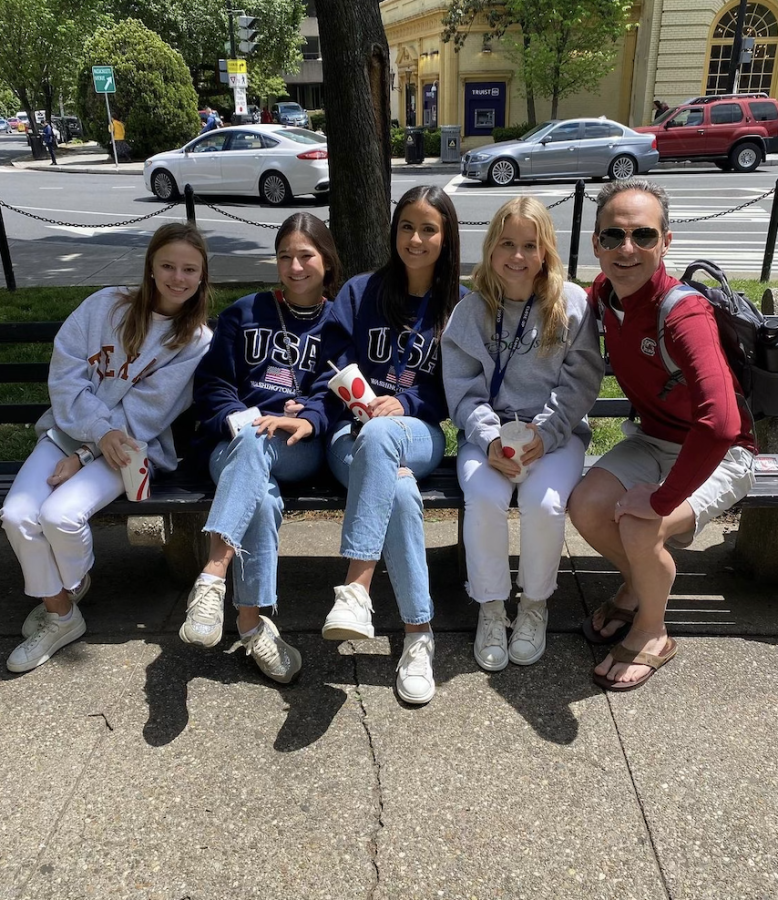 Janie Lee 25, Sophie tam 25, Alexis Del Pozzo 25, Elizabeth Dike 25, and Andrew Thomas sitting in the DuPont Circle after lunch.