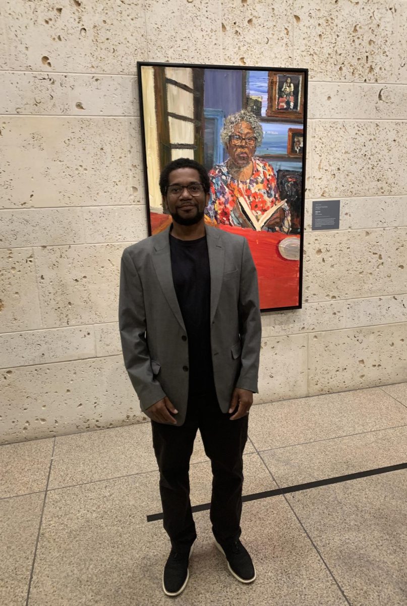 Sedrick Huckaby stands in front of his portrait of Opal Lee after their presentations at the Amon Carter Museum.