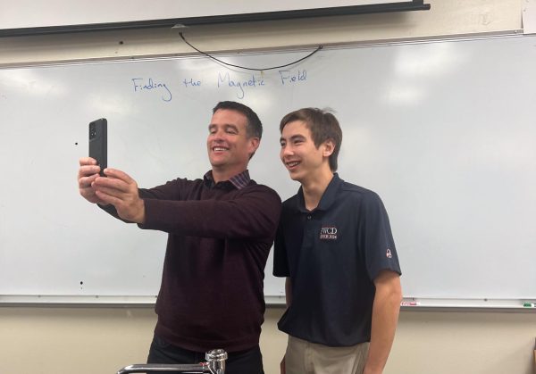 Dr. John Cordell takes a selfie with AP Physics student and fan, Richard Souchick ’24.