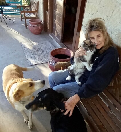 Carolyn Wofford sits down with her pets.