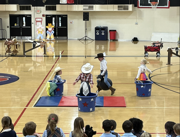 The Kindergarten class bull riding during the rodeo.