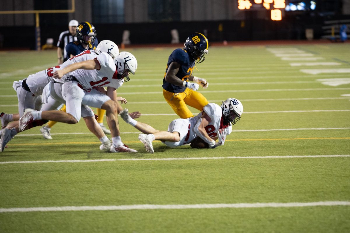 John David Hart '26 falls on the ball after Luke Mitchell '25 blocks a kick to win FWCD the game.