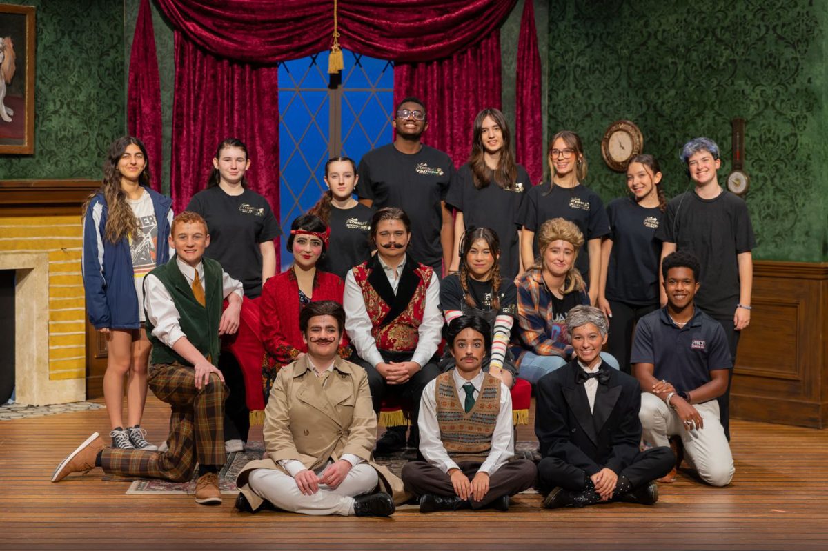 The whole cast and stage managers pose before their first full dress run in front of a cast. 