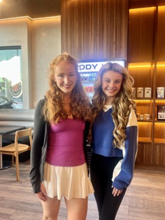 GiGi Helling '26 and Mallory James Mahoney have a chat over coffee on the TCU campus.