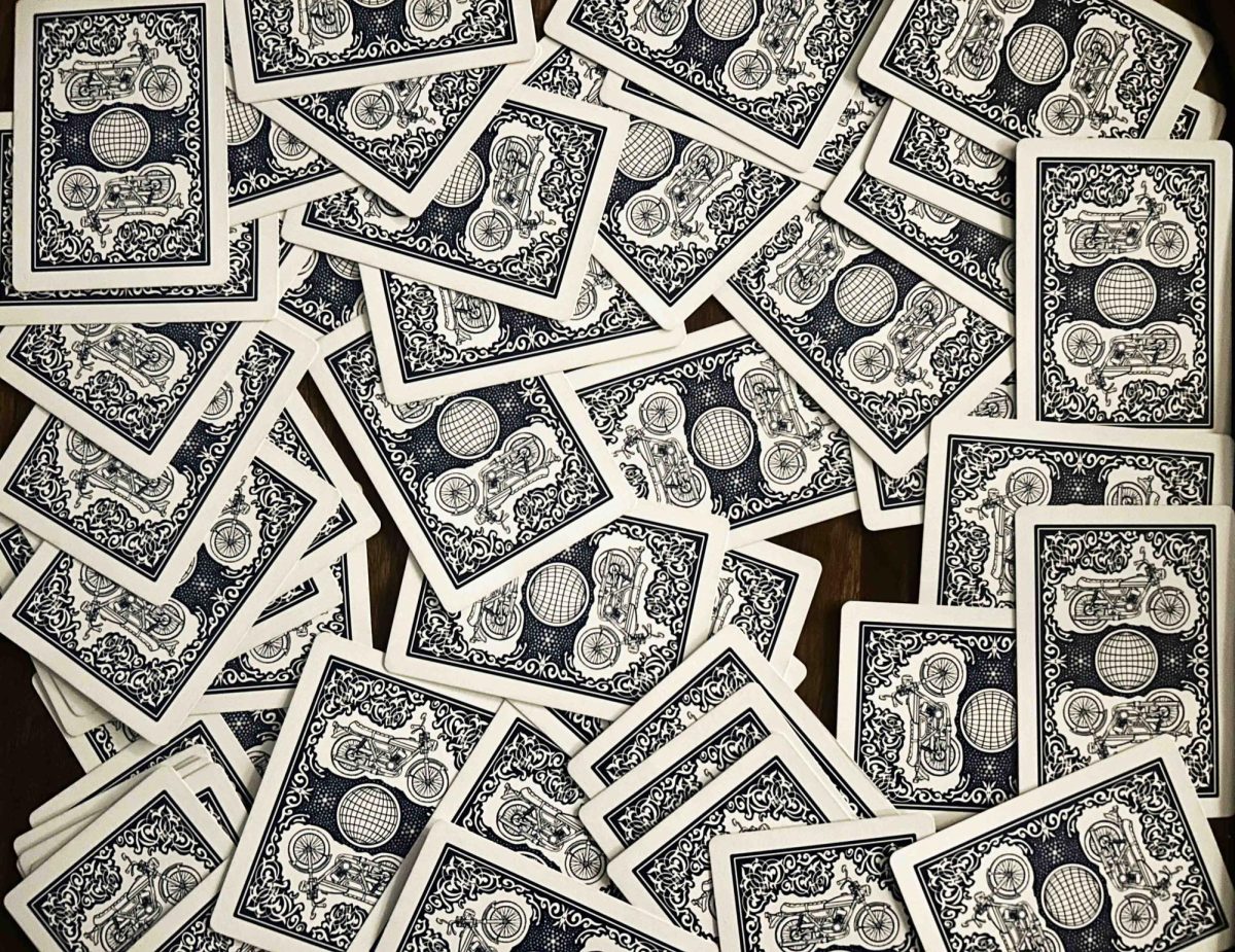 A standard deck of 52 cards spread out on a table