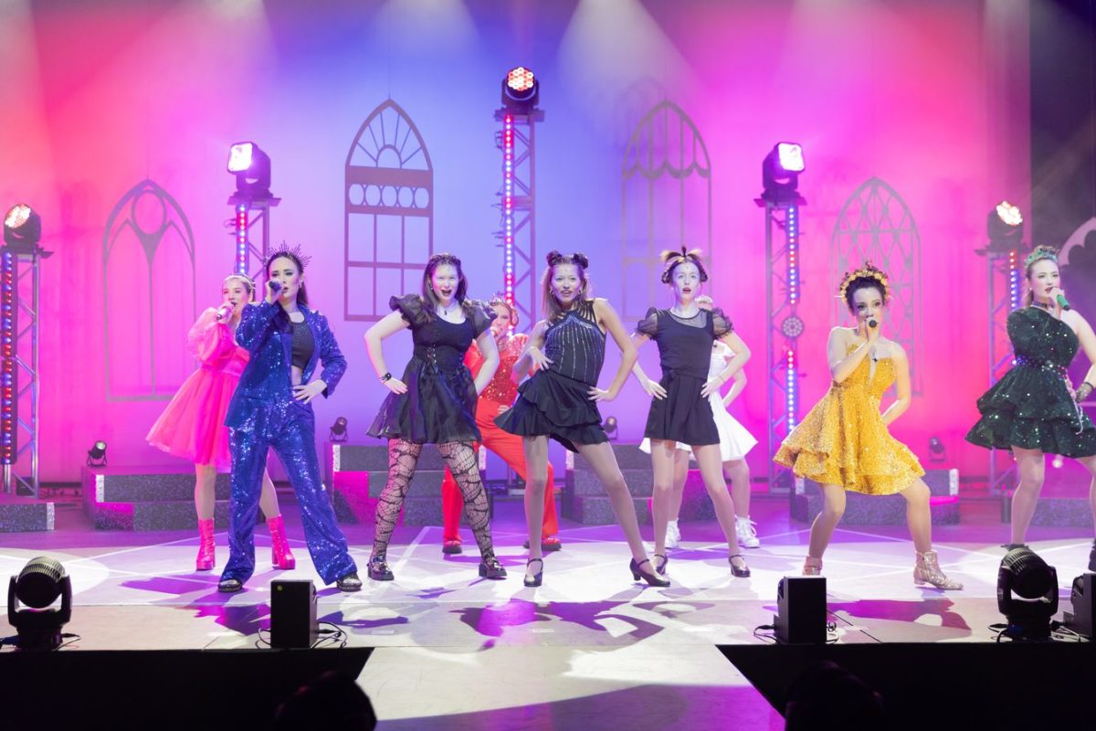 Performers dance on stage during SIX: Teen Edition. The high schoolers show attitude during the opening number of the show.
