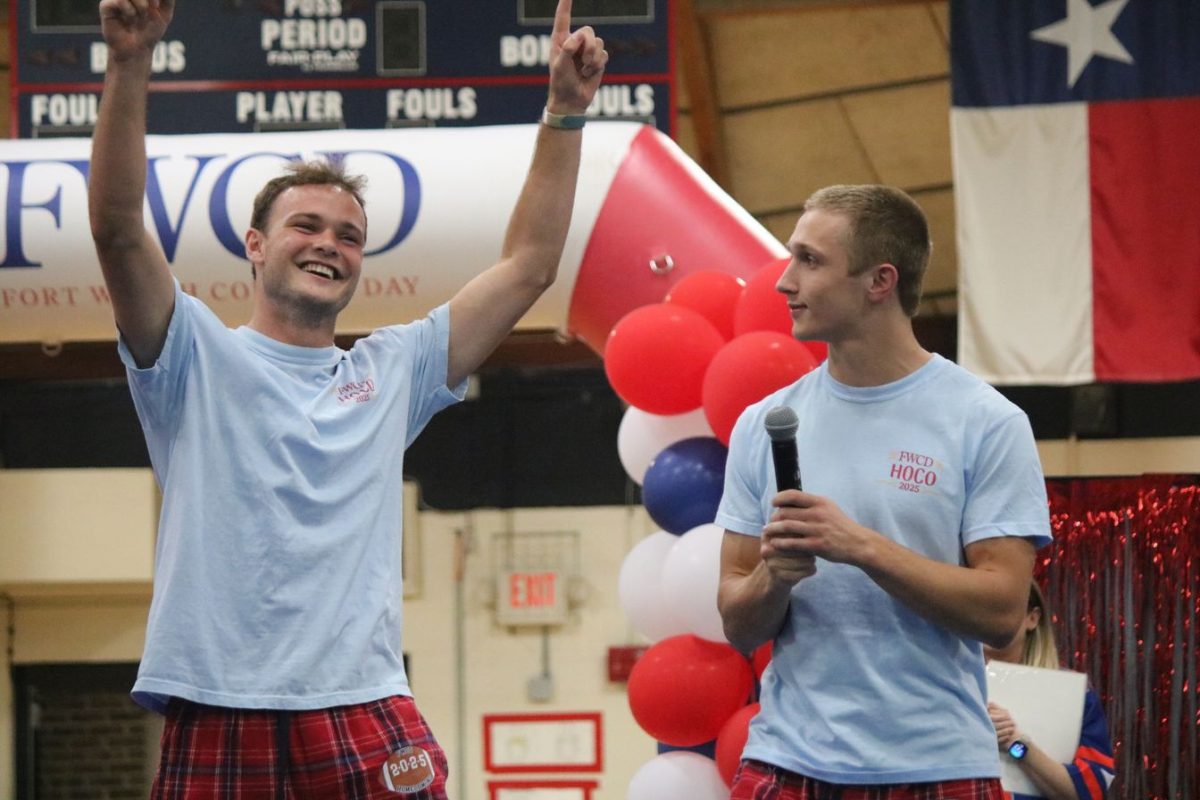 Varsity football captains Fox Burton '26 and Canaan Factor '26 are reviewing the season they have had so far at the homecoming pep rally.