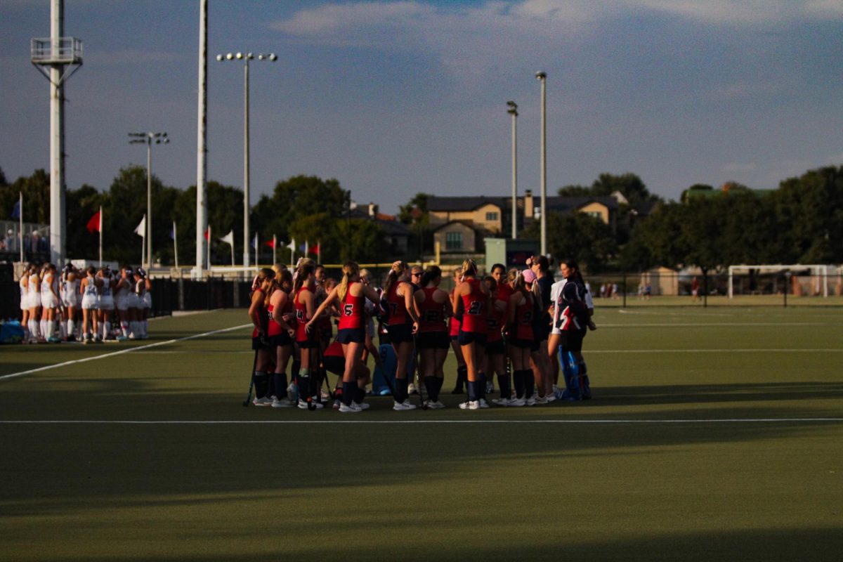 Varsity Field Hockey huddles up after a great first half against TVS.