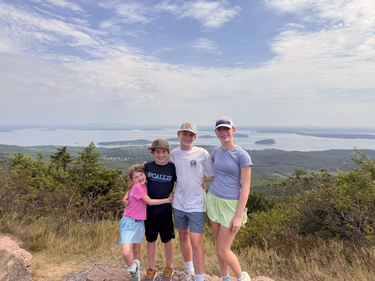 Sarah Mitchell McMillan '29, Taylor McMillan '31, William McMillan '34, and Mary Blake McMillan '37 hike and enjoy the views on Cadillac Mountain,  Maine.
