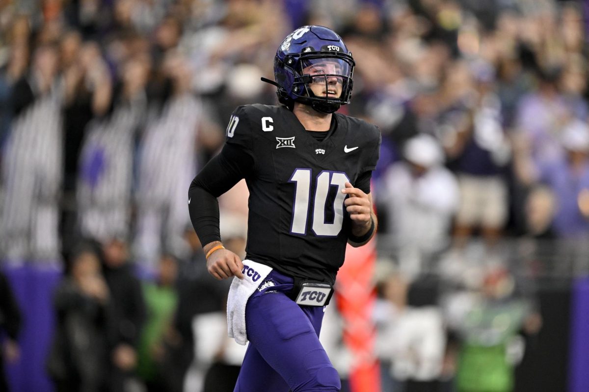 Nov 29, 2025; Fort Worth, Texas, USA; TCU Horned Frogs quarterback Josh Hoover (10) runs off the field after throwing for a touchdown against the Cincinnati Bearcats during the first half at Amon G. Carter Stadium. Mandatory Credit: Jerome Miron-Imagn Images