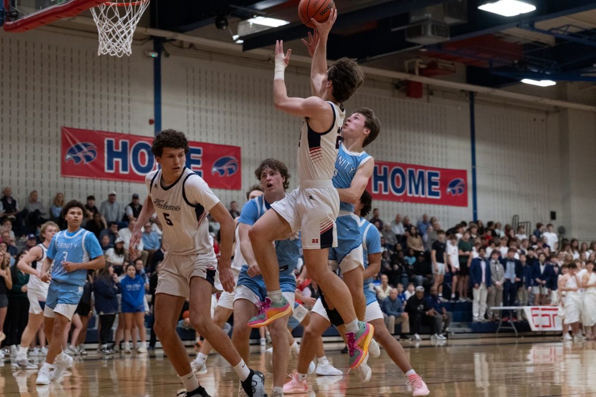 Jack Wegman '26 shoots a lay-up against TVS.