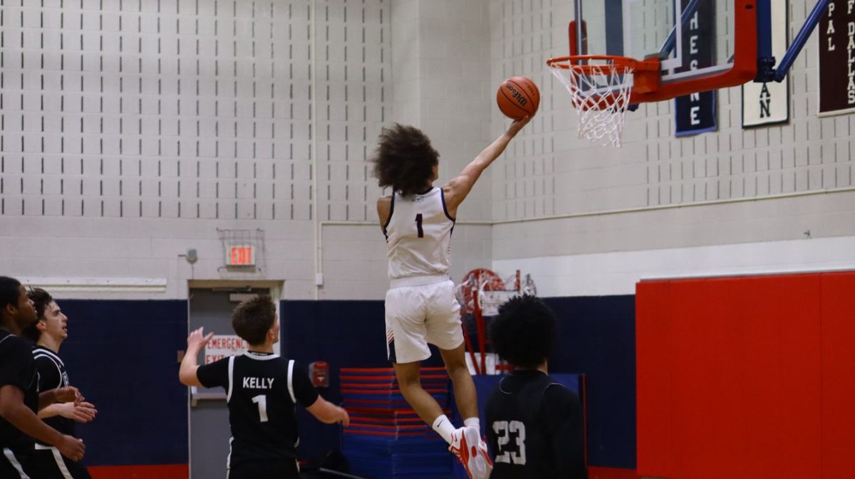 Kai Chancellor '27 goes in for a lay-up during a home game early in the season.
